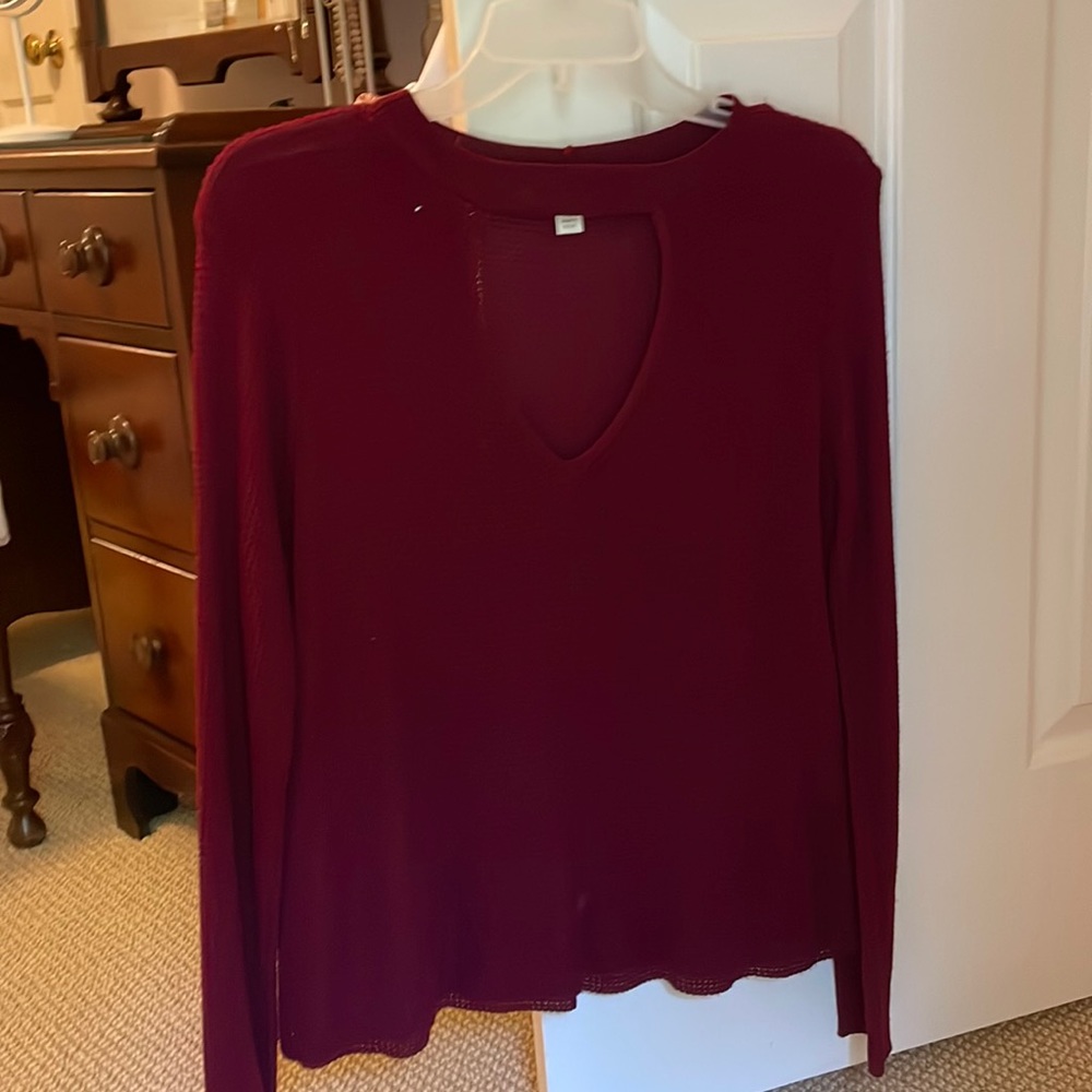 Maroon colored long sleeve sweater